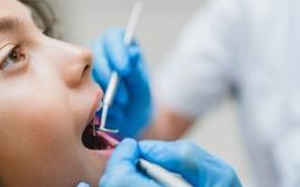 Child's teeth being examined by dentist