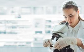 medical_scientist_researcher_using_microscope_laboratory.jpg